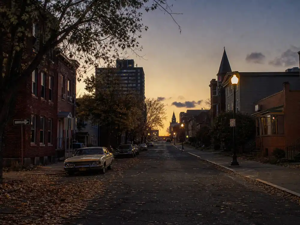 Syracuse New York street at dusk for what happened to Bobcat Goldthwait upstate comedy roots