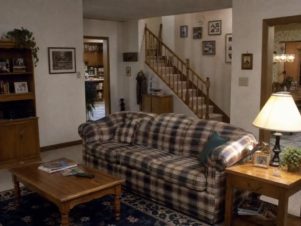 A cozy 1990s suburban living room evoking the Matthews family home from Boy Meets World and the Girl Meets World spinoff era