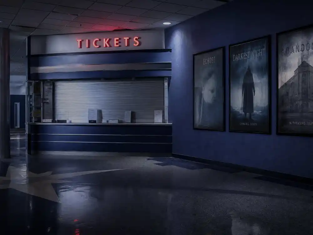 A dark empty multiplex lobby symbolizing the Brendan Fraser acting career decline years