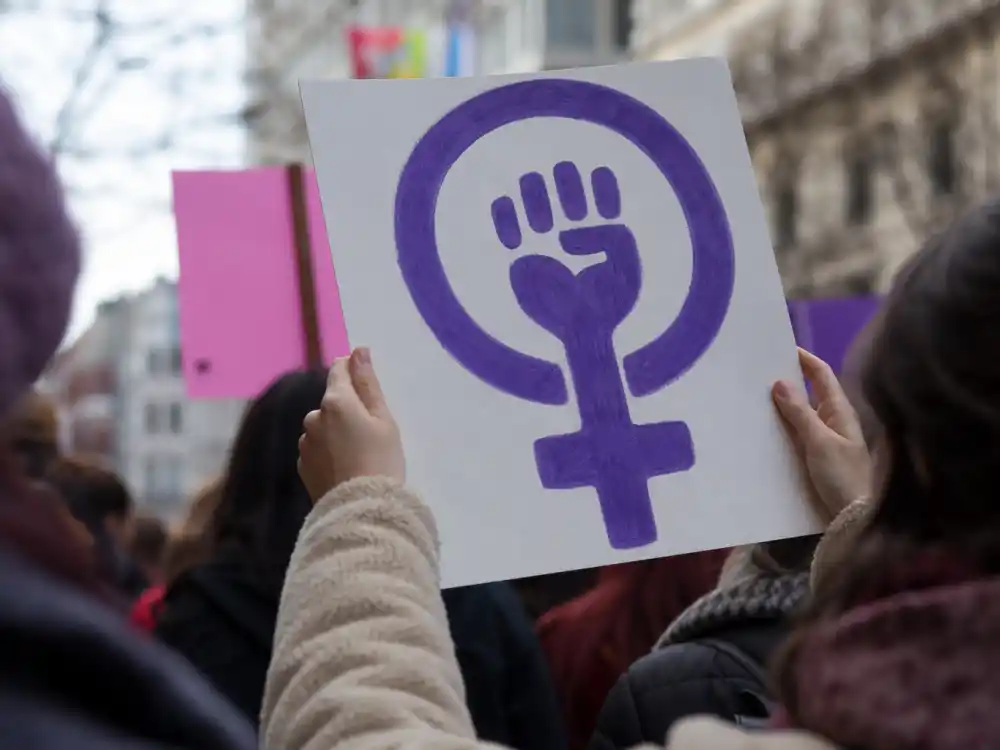 Anonymous hands at a peaceful demonstration reflecting Brendan Fraser MeToo testimony and industry solidarity