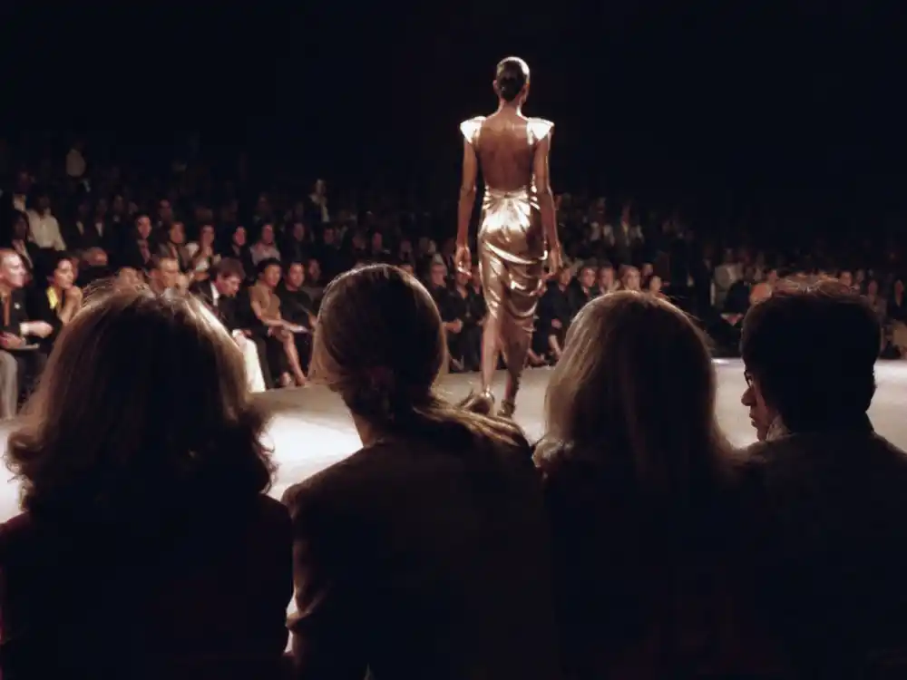 A 1980s fashion runway from behind for Brigitte Nielsen supermodel and glamazon breakthrough era