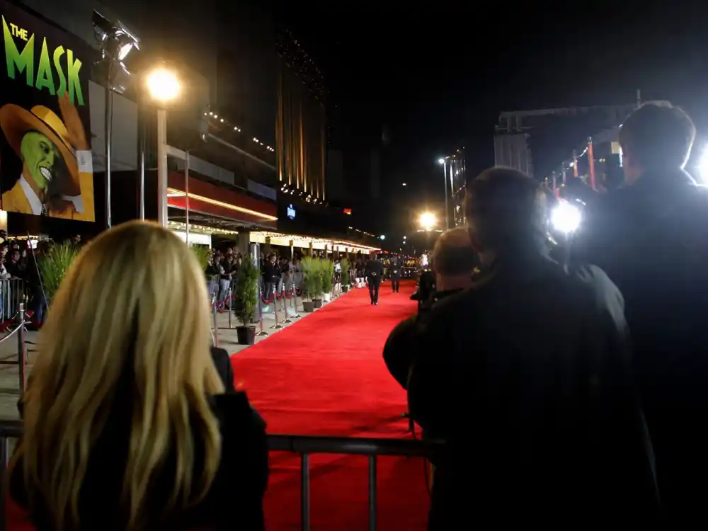 Empty red carpet flash bulbs evoking Cameron Diaz rise to stardom in the Charlie Angels blockbuster era