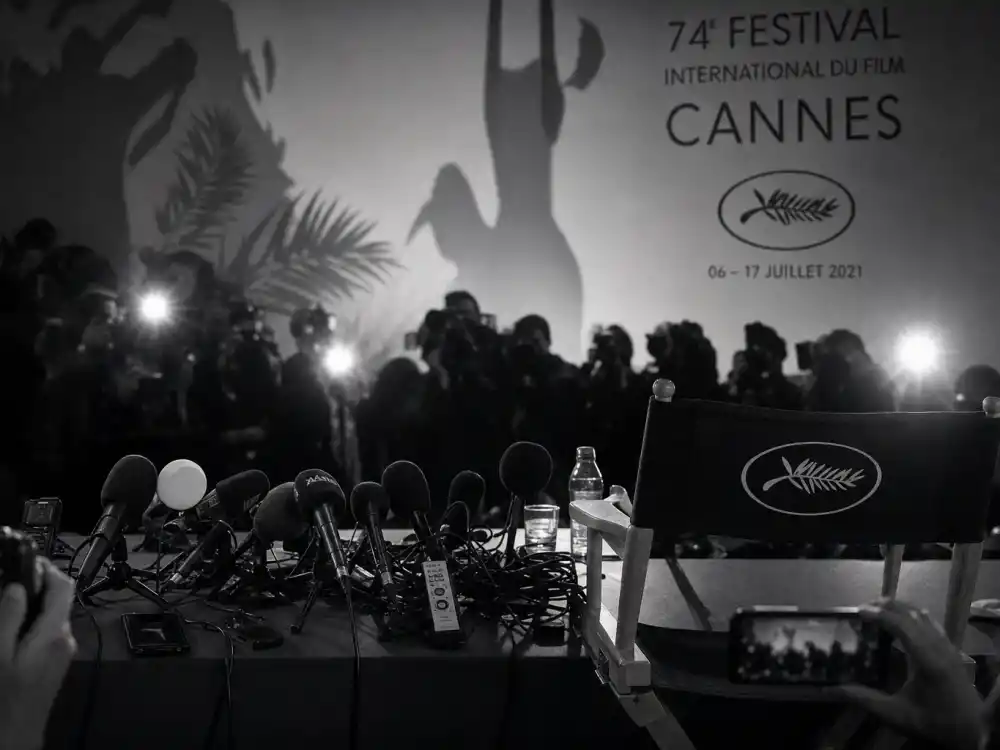 Tense festival press conference microphones documenting Cannes most controversial moments history from von Trier to Palme fallout