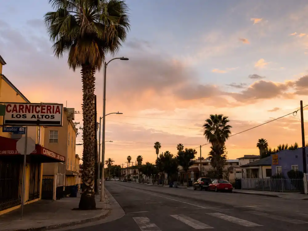 East Los Angeles street at dusk for what happened to Carlos Mencia and his comedy club beginnings