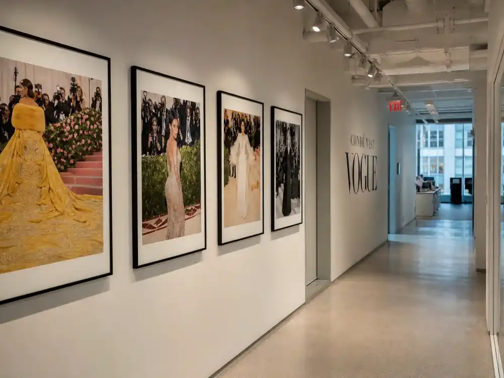 Vogue editorial office hallway — celebrities banned from the Met Gala are decided in Condé Nast planning meetings co-produced with the Costume Institute