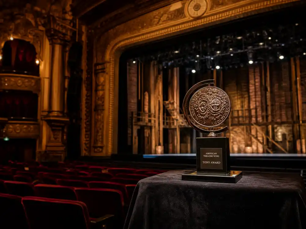 Broadway theatre interior with Tony Award medallion for celebrities close to an EGOT who still need a competitive theatre prize