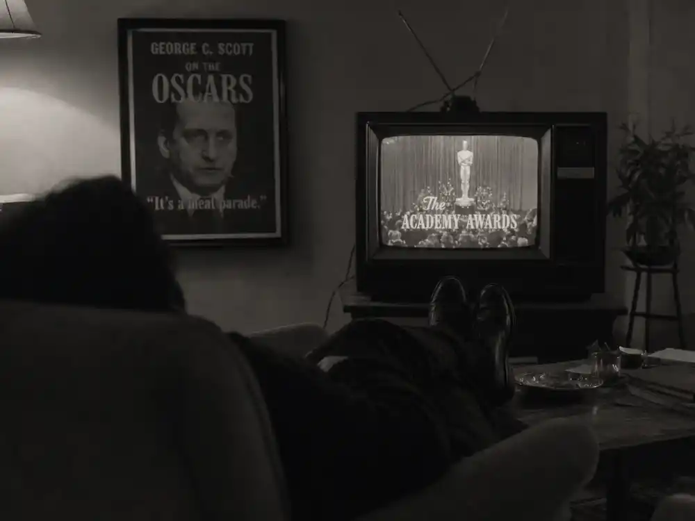 Anonymous actor silhouette sleeping through Oscar telecast on couch evokes George C Scott criticism among celebrities who criticized the Oscars as a meat parade