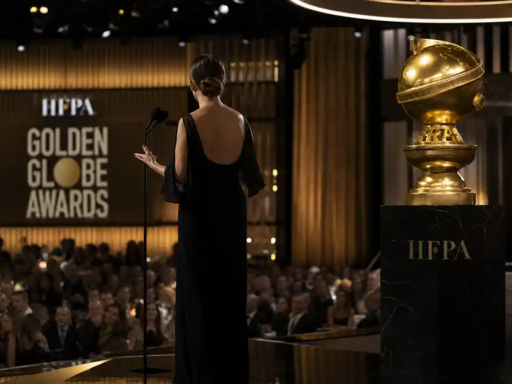 Golden Globes ballroom podium silhouette represents Meryl Streep 2017 political speech among celebrities who got political at award shows