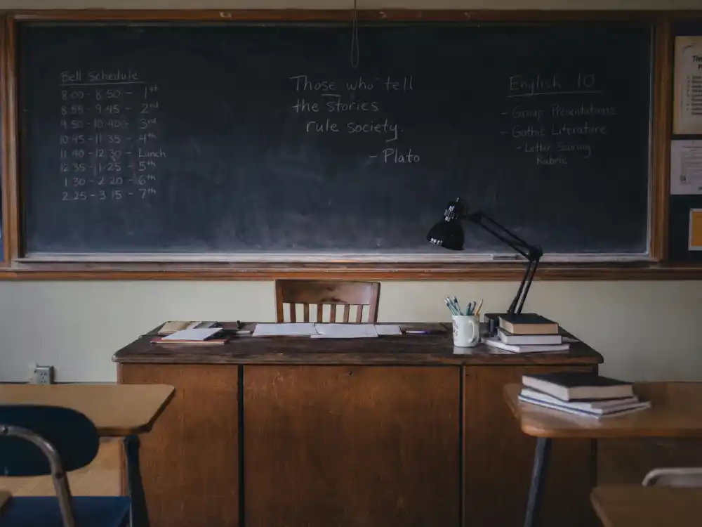 Empty classroom desk representing second careers built by celebrities who quit Hollywood acting