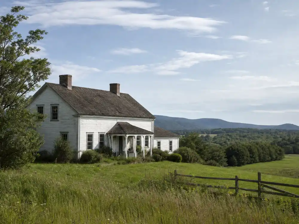 Rustic New England farmhouse evoking rural retreats chosen by celebrities who quit Hollywood