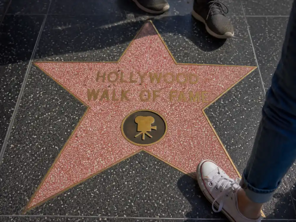 Tourists stepping near a Walk of Fame star — a rumored reason celebrities who refused a Walk of Fame star dislike sidewalk honors