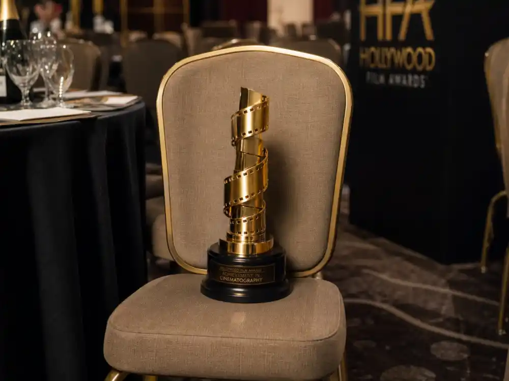 Golden trophy on an empty banquet chair symbolizes George C. Scott and other celebrities who refused or declined awards after winning competitive categories