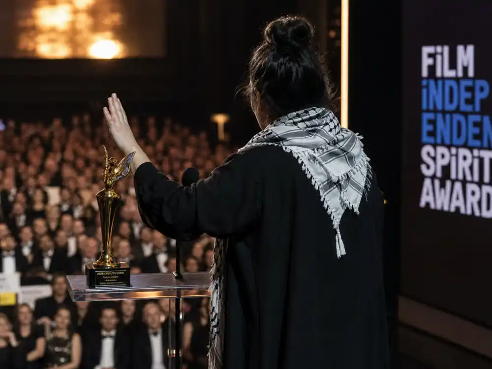 Silhouette at an awards podium declining a trophy recalls proxy speeches and celebrities who skipped accepting their awards on live television