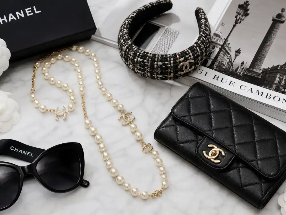 Pearl necklace tweed headband and quilted clutch flat lay capturing accessory codes celebrities who wear Chanel layer with jackets and evening columns