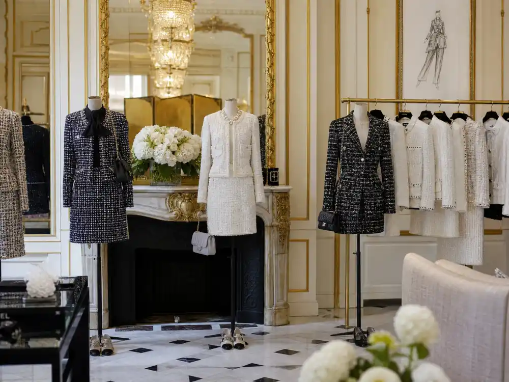 Paris luxury showroom with tweed suits on mannequins where celebrities who wear Chanel source couture fittings and ready-to-wear for global fashion weeks