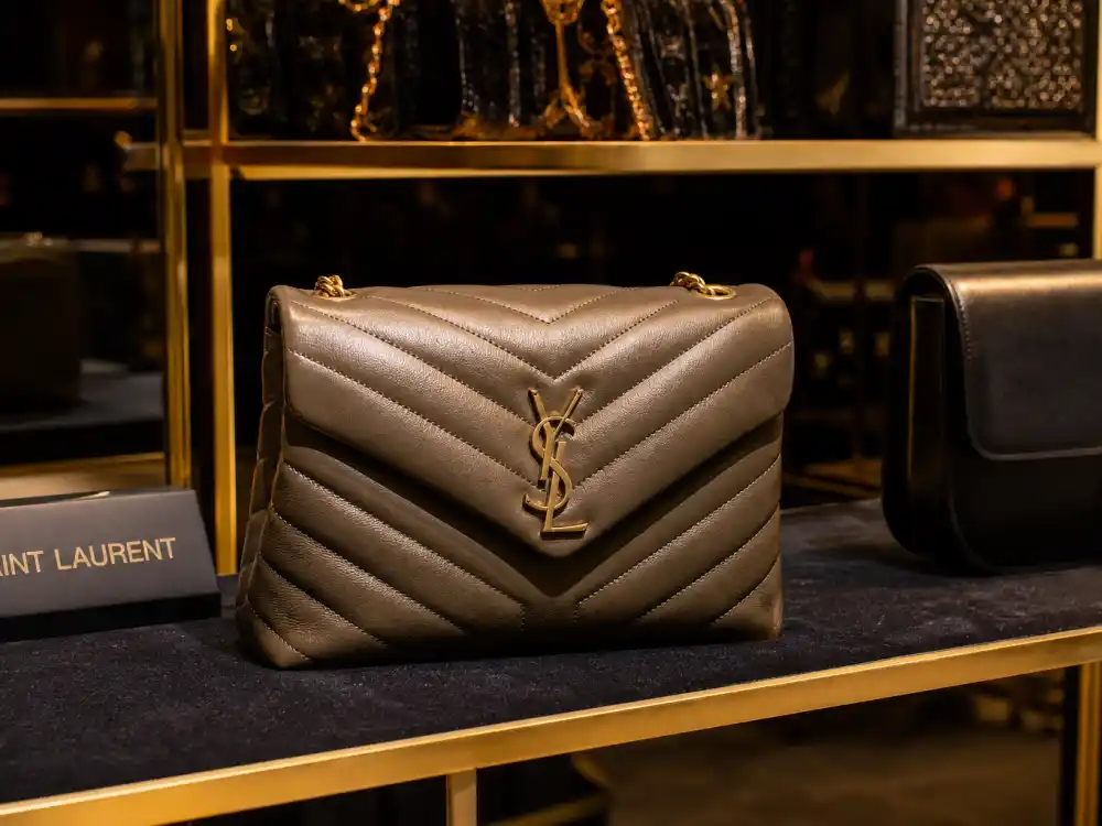 Saint Laurent LouLou quilted leather handbag with gold YSL monogram defining the accessory code celebrities who wear Saint Laurent carry to paparazzi outings and front rows