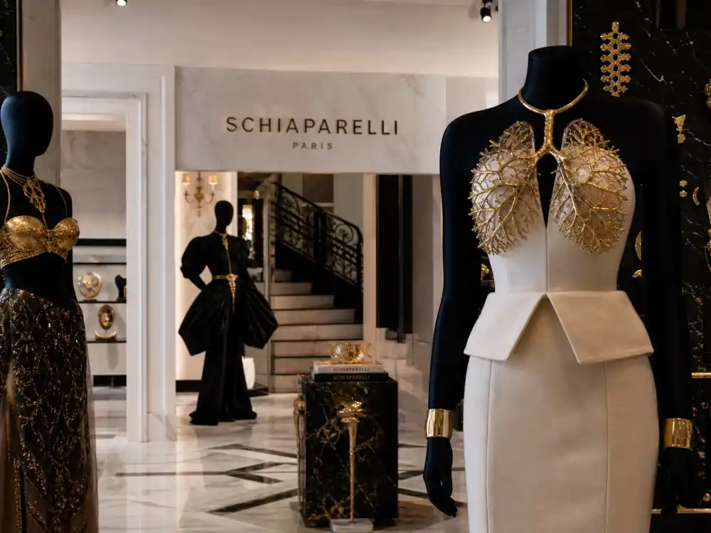 Schiaparelli Paris boutique interior with surreal couture mannequins and gold jewelry displays where celebrities who wear Schiaparelli source fittings before fashion month circuits