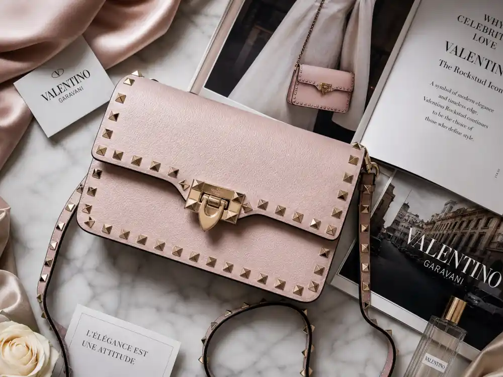 Valentino Rockstud handbag flat lay with silk swatches capturing accessory codes celebrities who wear Valentino layer with couture columns and premiere tailoring
