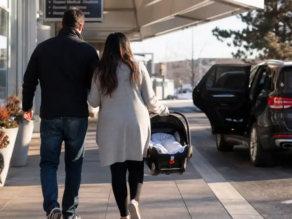 Hospital discharge from behind for celebrity birth announcements Instagram 2026 surrogacy caption trend — Meghan Trainor Mikey Moon reveal model