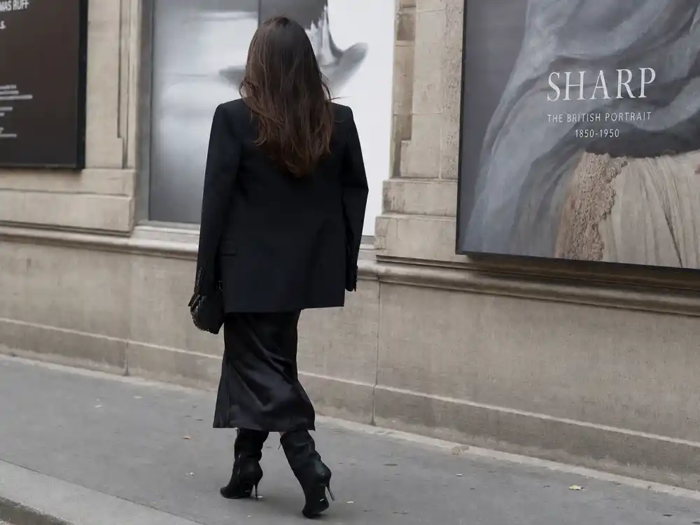 Structured black blazer over slip midi dress and boots elevating celebrity blazer street style outfits gallery-district off-duty dressing