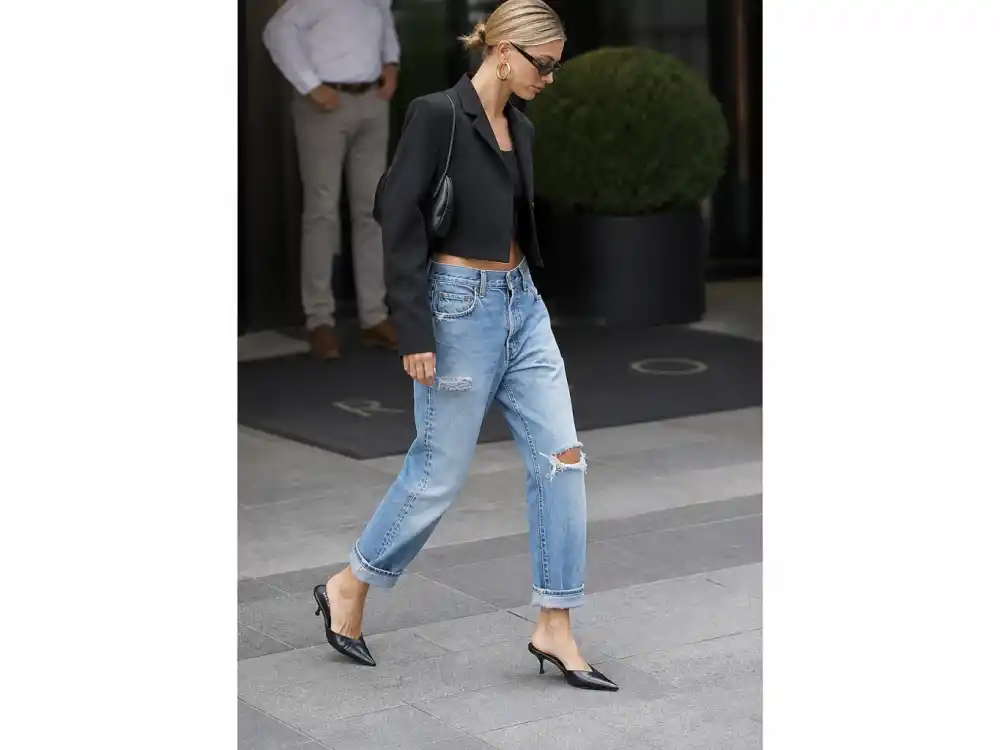 Distressed boyfriend jeans with pointed heels showing celebrity denim street style looks elevated casual codes