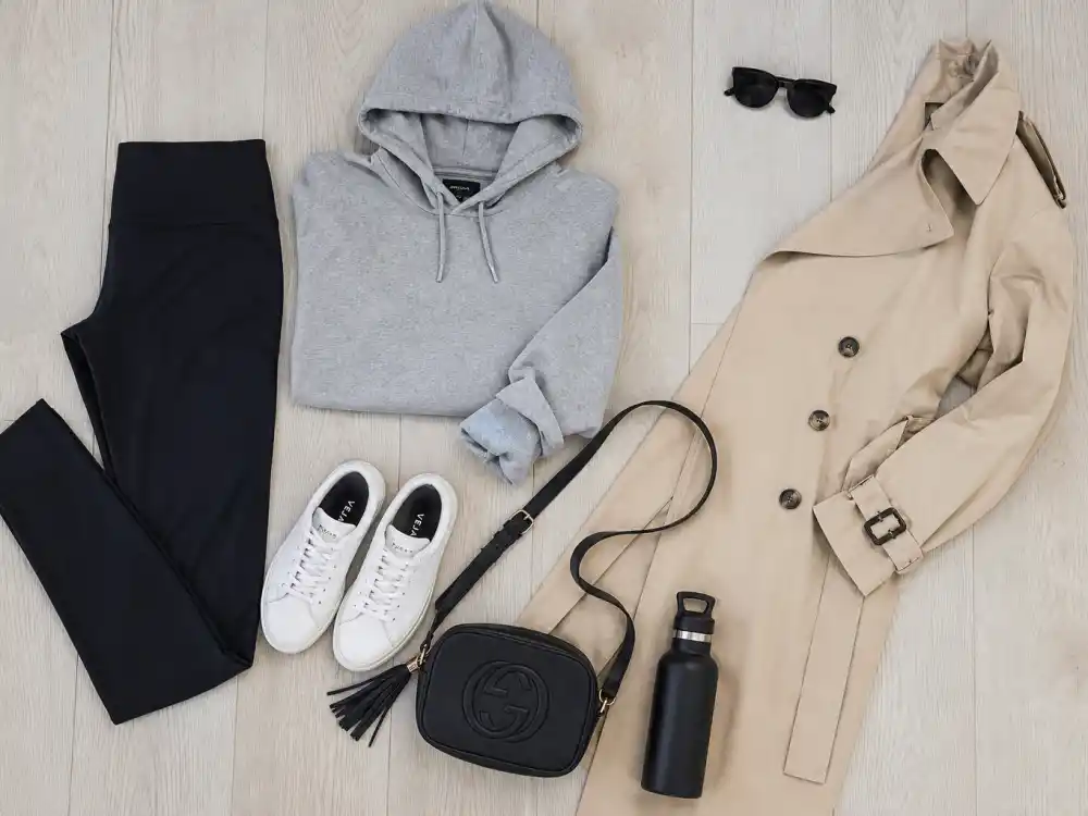Neutral capsule flat lay for celebrity gym to street style outfits mix-and-match essentials wardrobe building