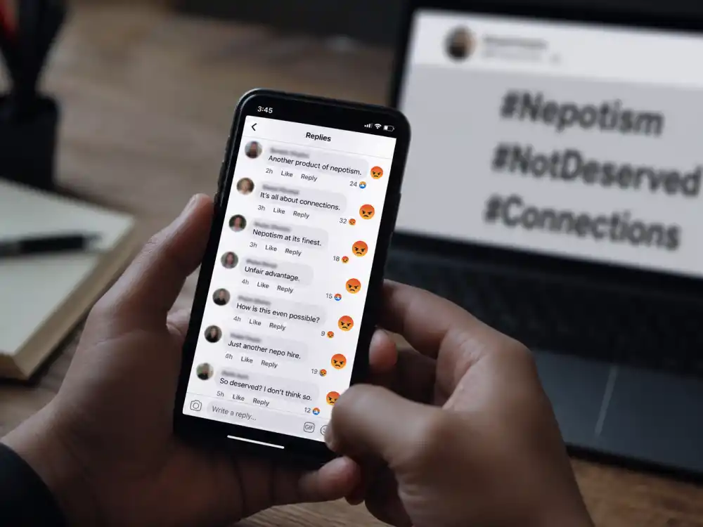 Social media backlash smartphone comment thread for celebrity kids rejecting nepo baby label online discourse editorial without identifiable faces