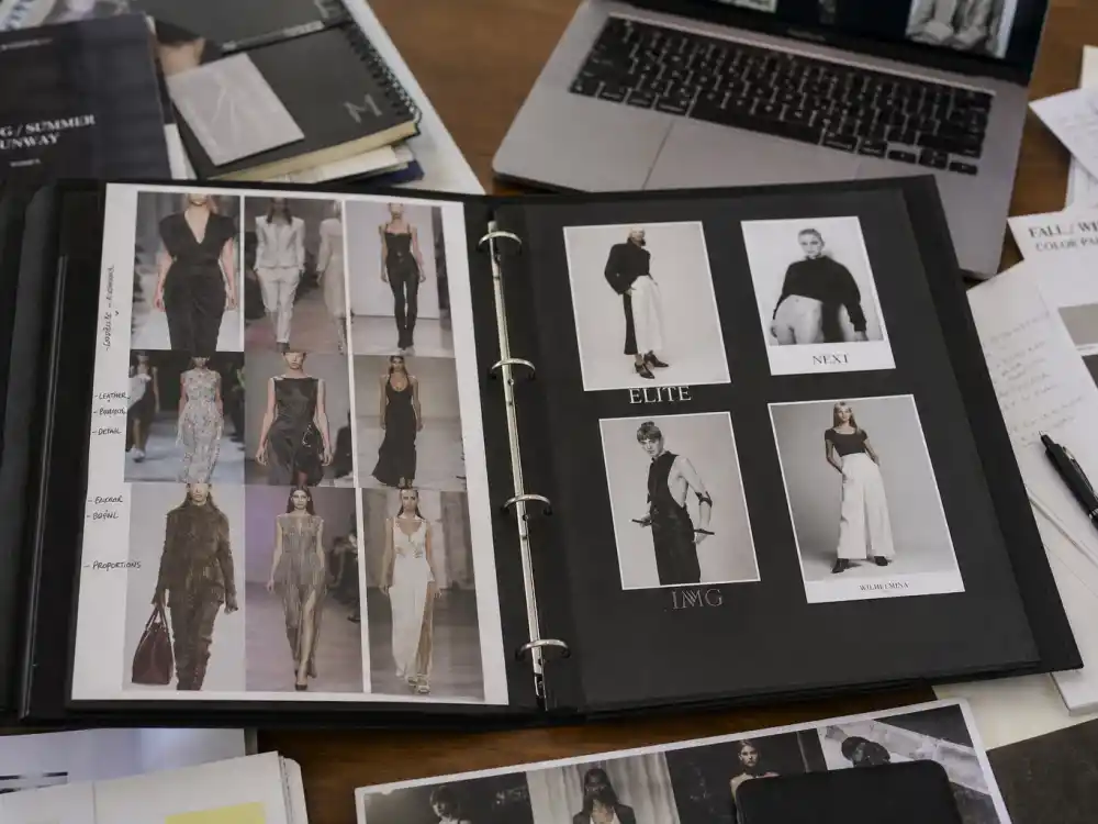 Modeling portfolio spread open on desk for celebrity kids turned models list 2026 verified runway and editorial credits editorial without identifiable faces