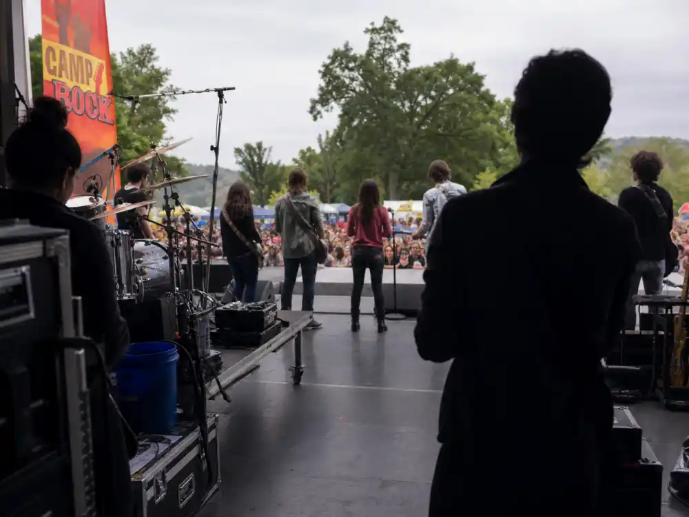 Camp Rock outdoor stage from behind for celebrity kids who started on Disney Channel music movie editorial without identifiable faces
