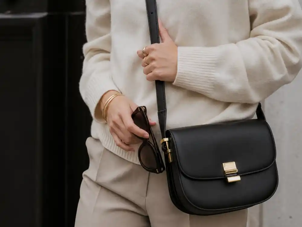 Cat-eye sunglasses gold hoops and crossbody bag finishing celebrity model off duty outfits accessory layer