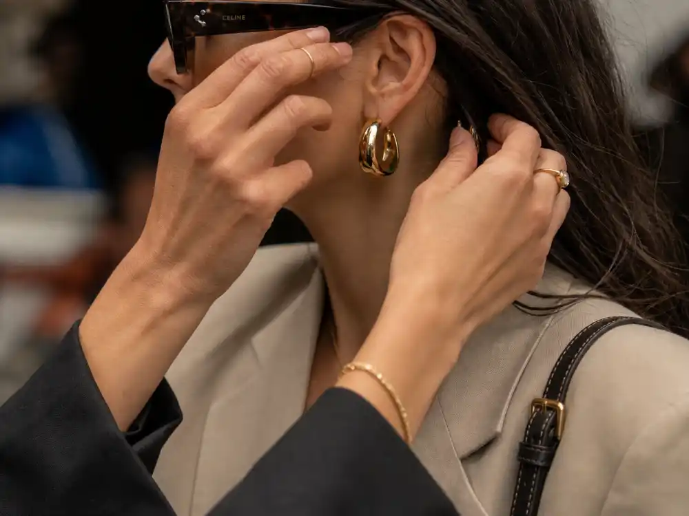 Sunglasses gold hoops and leather crossbody finishing celebrity off duty street style guide accessory rules