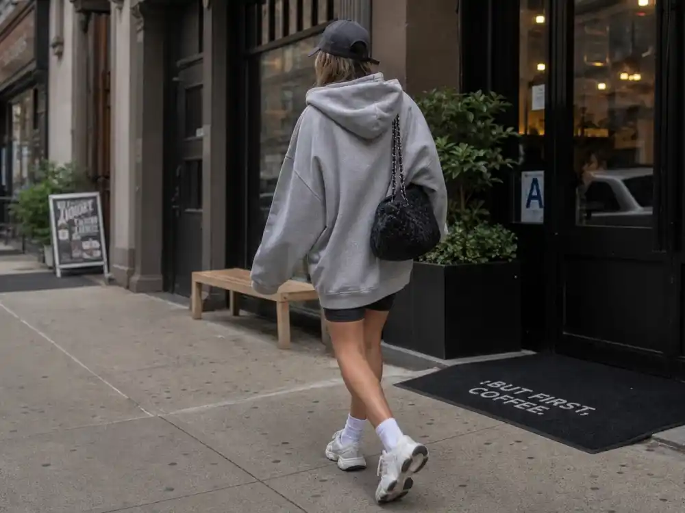 Oversized hoodie and sneakers central to celebrity off duty street style guide casual uniform codes