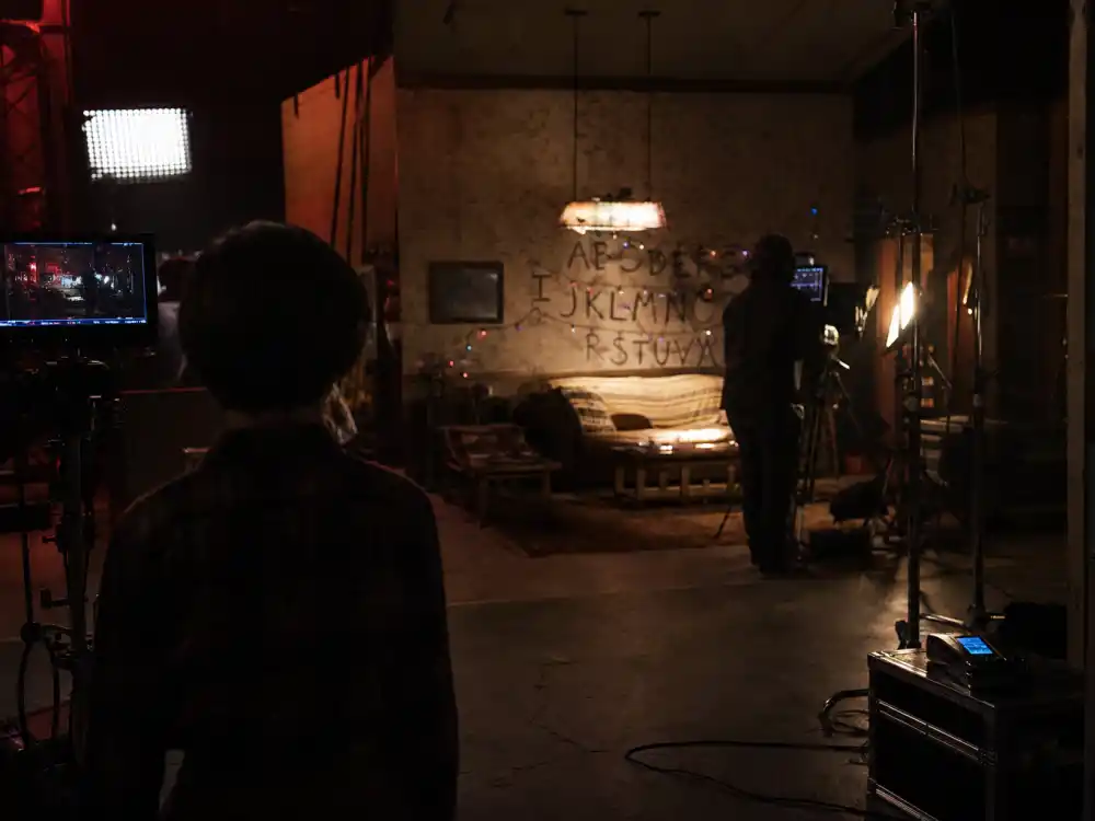 Television drama soundstage from behind for celebrity offspring breaking into Hollywood 2026 Maya Hawke Stranger Things streaming lane editorial without identifiable faces