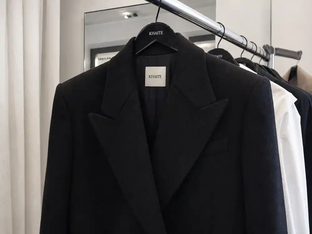 Oversized structured wool blazer central to celebrity street style power-shoulder tailoring codes on city sidewalks