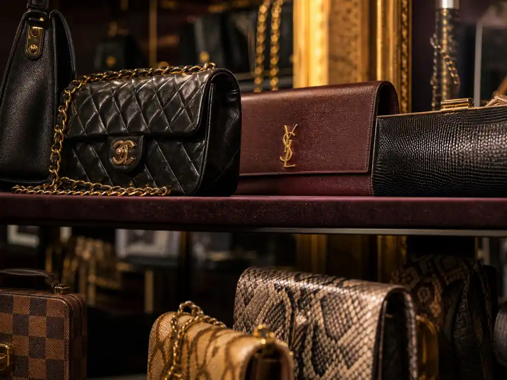 Vintage designer handbags on velvet boutique shelf capturing accessory resale lane within celebrity vintage designer fashion styling and authentication