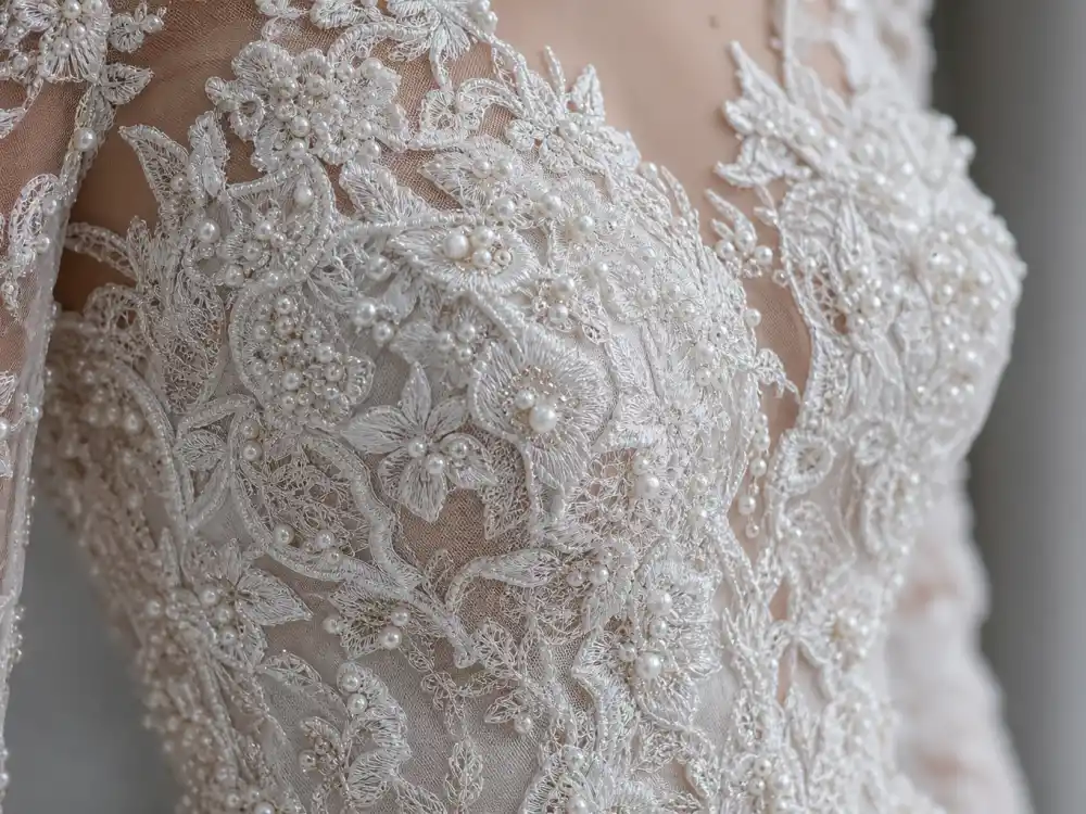 French lace and pearl beading couture detail central to celebrity wedding dresses most iconic bridal craftsmanship