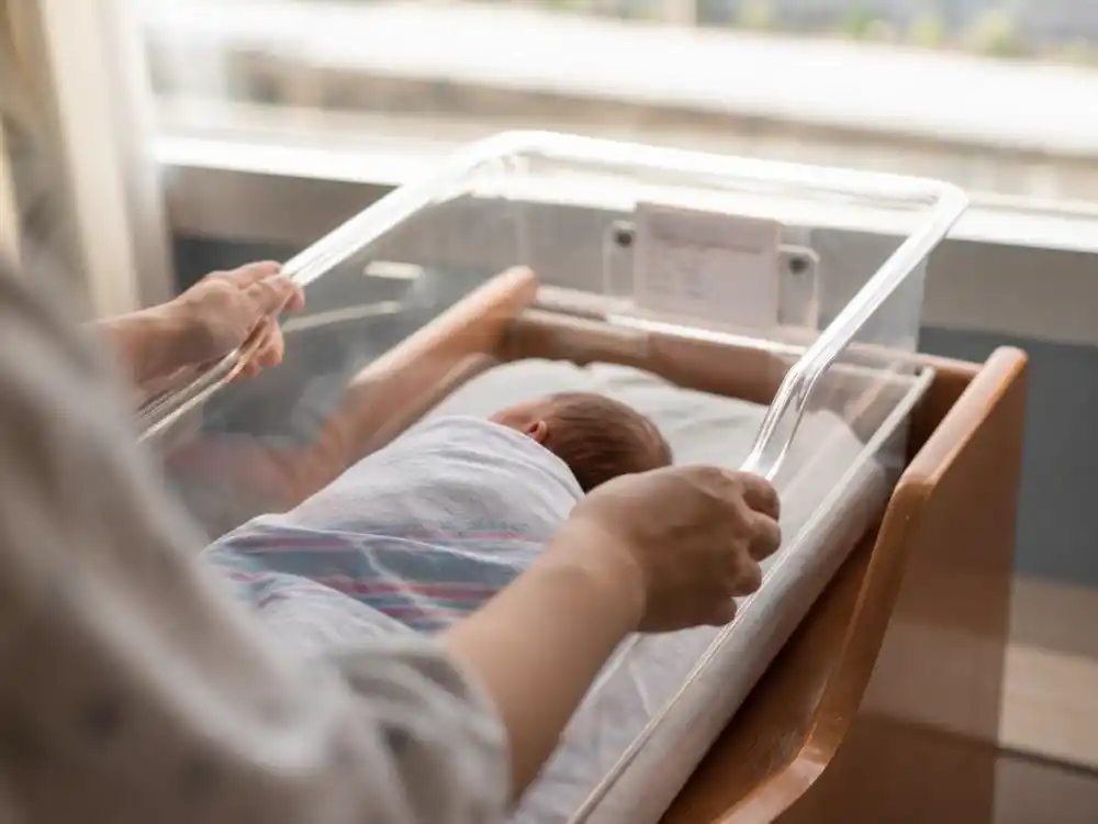 Hospital newborn bassinet for Chrissy Teigen IVF and surrogacy timeline — Esti Maxine Stephens January 13 2023 carried rainbow birth