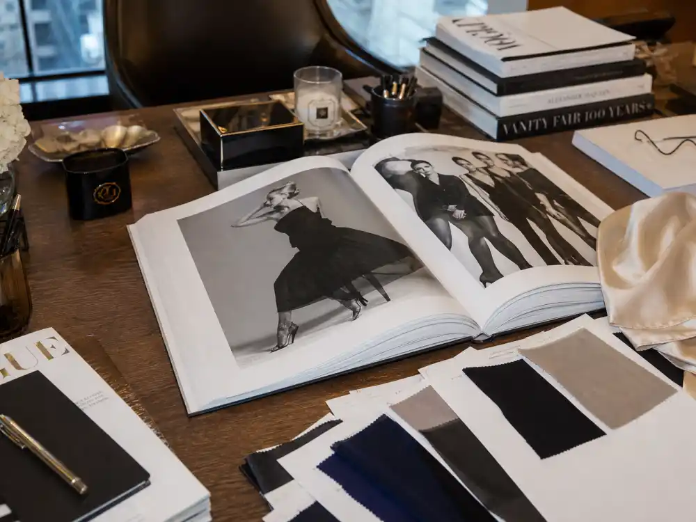 Fashion mogul desk with supermodel archive book for Claudia Schiffer business empire today