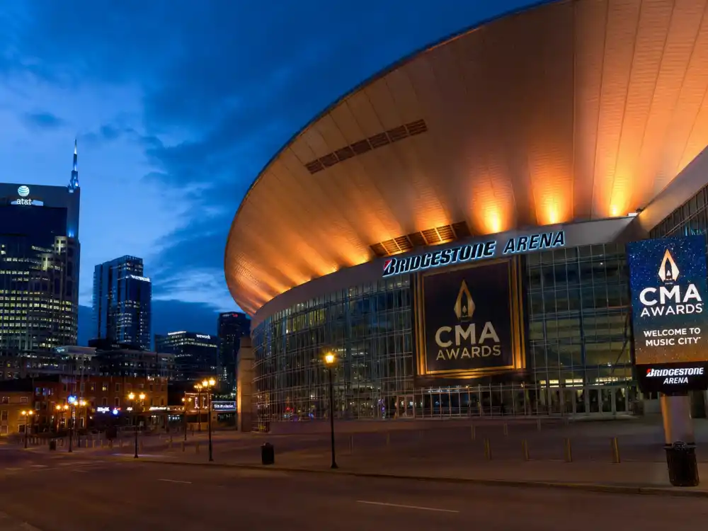Bridgestone Arena Nashville exterior at dusk where CMA Entertainer of the Year winners by year accept country music highest honor each November