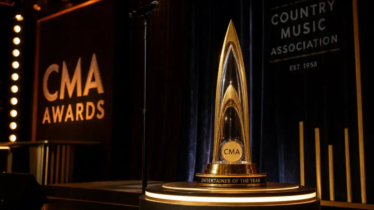 CMA Entertainer of the Year winners by year — golden Country Music Association trophy on illuminated Nashville awards ceremony stage