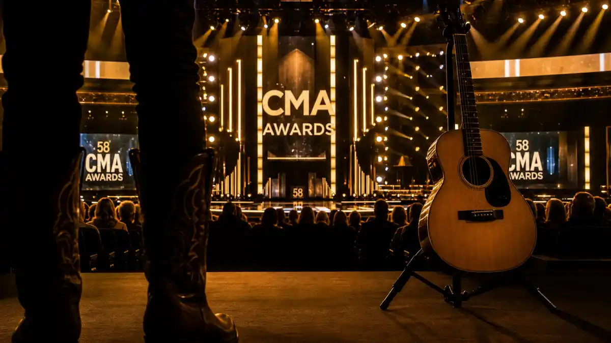 CMA vs ACM Awards difference — country music awards stage in Nashville with golden spotlights and acoustic guitar