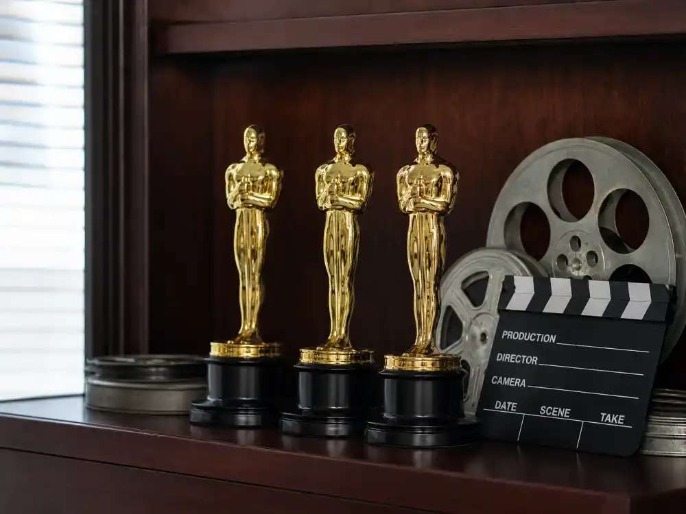 Three Oscar statuettes on a shelf for Daniel Day-Lewis record three Best Actor wins at peak fame
