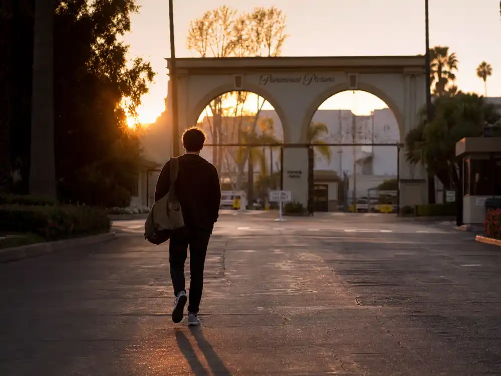 Silhouette leaving film studio gate for Danny Lloyd decision to quit acting after The Shining