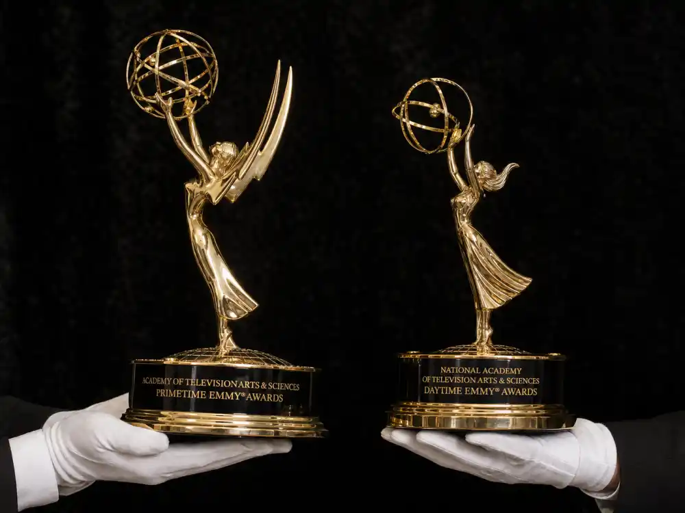 Side-by-side Primetime and Daytime Emmy statuette comparison clarifies trophy design in the difference between Primetime and Daytime Emmys