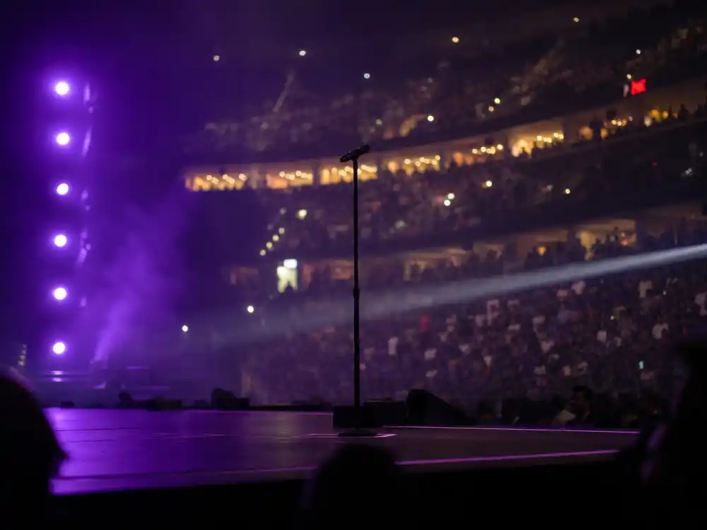 Arena concert stage reflecting Drake age and birthday 2026 touring milestones from club shows to stadium-scale headline runs in his thirties