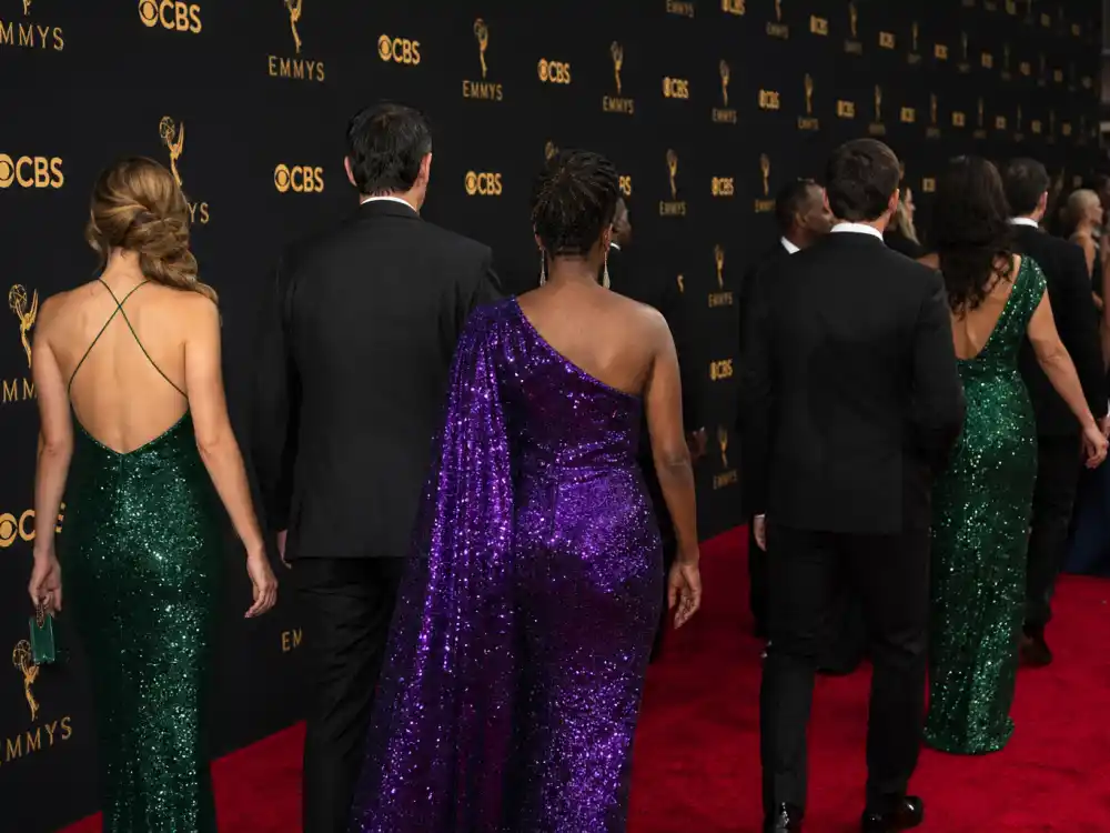 Jewel-tone sequined evening wear trend on Emmys best dressed of all time carpet — anonymous guests in formal TV awards glamour