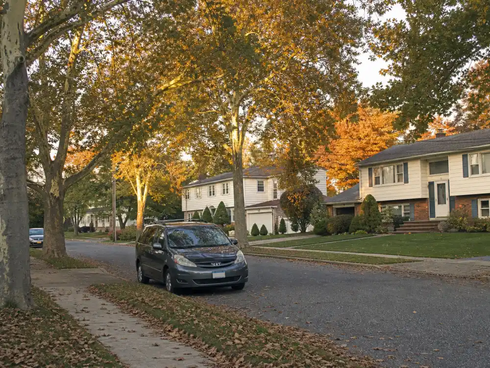 Quiet Long Island suburban street representing the Everybody Loves Raymond cast where are they now neighborhood setting