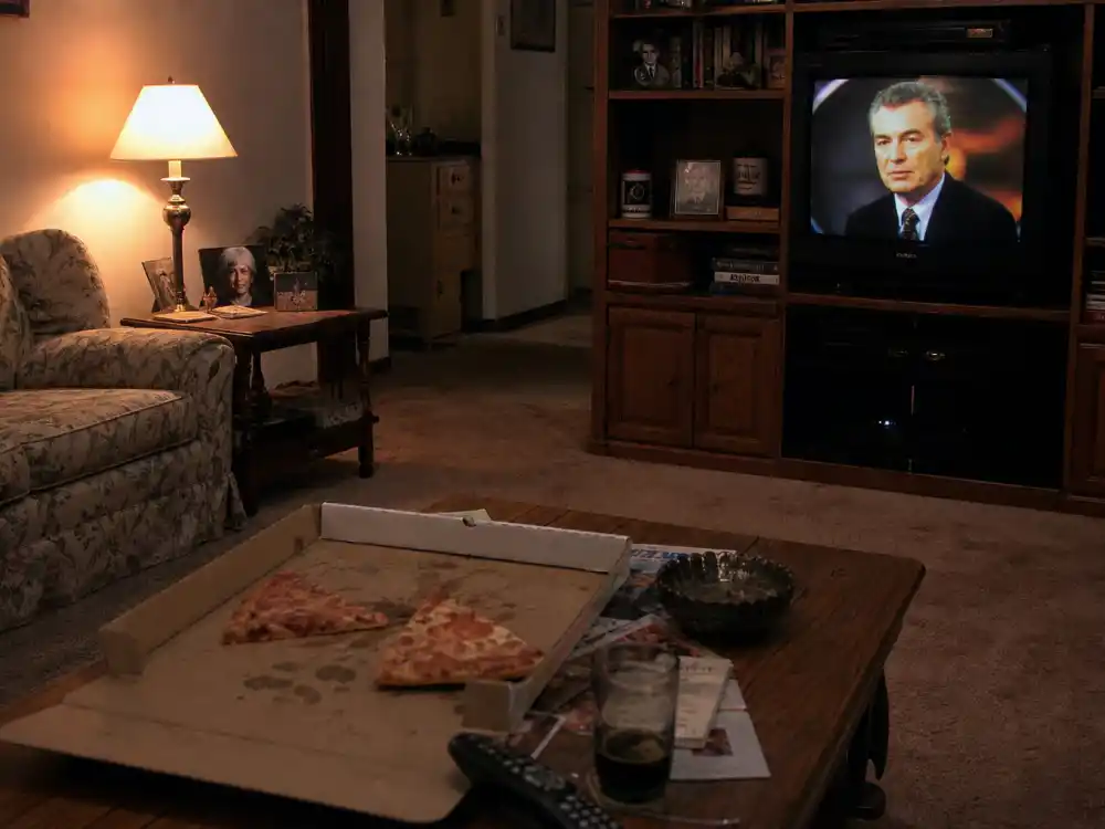 1990s Friday night living room with pizza and TV remote evoking Family Matters cast where are they now TGIF nostalgia