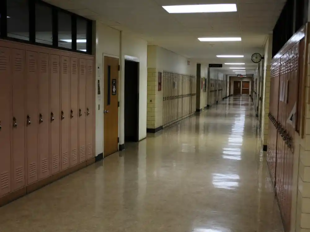 An empty 1990s high school hallway for Fred Savage adult acting after Wonder Years ended