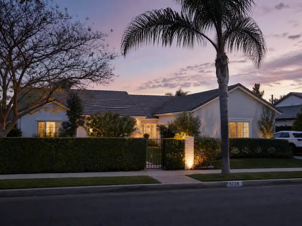 California suburban home at dusk for Fred Savage family life with wife Jennifer Stone and children